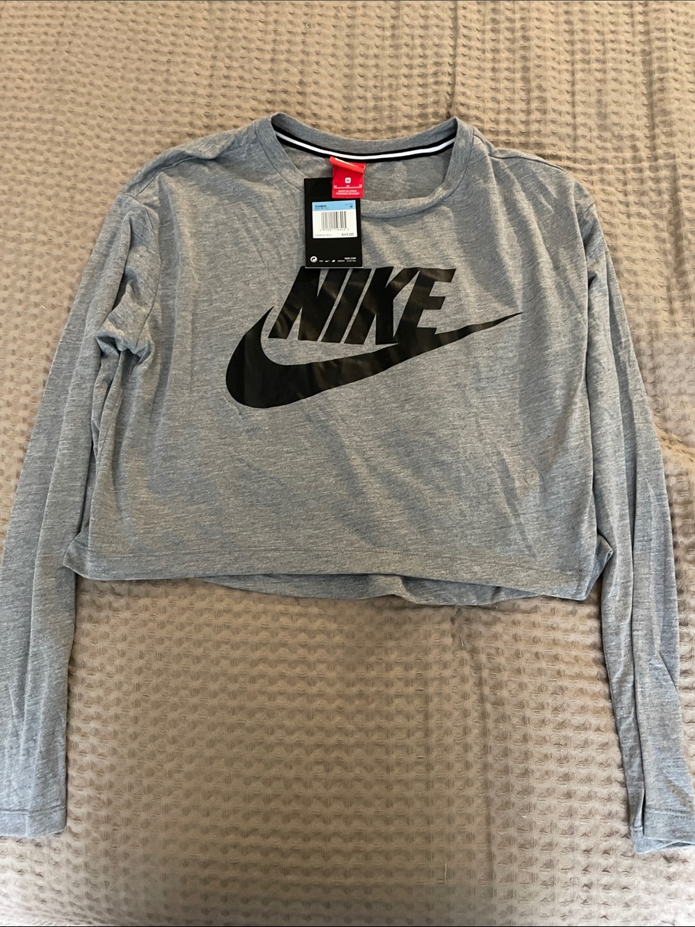 Nike Light Gray Cropped Long Sleeve Top with Black Swoosh